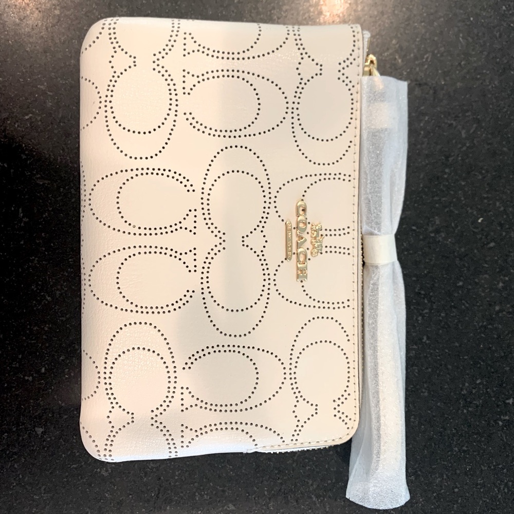 Coach Signature zip top perforated leather wristlet